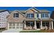 Beautiful two-story brick home with a covered porch and a two-car garage, perfect for suburban living at 3325 Linstead Ct, Loganville, GA 30052