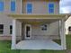 Inviting covered outdoor patio with brick accents and outdoor lighting, a perfect entertaining space at 3325 Linstead Ct, Loganville, GA 30052