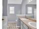 Bathroom featuring double sinks, and a tub/shower combo, and neutral paint at 939 Redan Trce, Stone Mountain, GA 30088