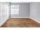 Bedroom features hardwood flooring, white trim and neutral paint providing a bright and airy space at 939 Redan Trce, Stone Mountain, GA 30088