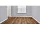 Bedroom featuring hardwood floors, neutral walls, and a bright window for natural light at 939 Redan Trce, Stone Mountain, GA 30088