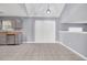 Open dining area with vaulted ceilings, tile floor, and sliding glass doors offering ample natural light at 939 Redan Trce, Stone Mountain, GA 30088