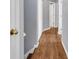 Hallway with wood-look flooring, neutral walls, and white trim throughout the house at 939 Redan Trce, Stone Mountain, GA 30088