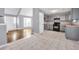 Open-concept with kitchen with gray cabinets, black appliances, and view of the adjoining living area at 939 Redan Trce, Stone Mountain, GA 30088