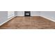 Living room with wood floors, fireplace and large window providing plenty of natural light at 939 Redan Trce, Stone Mountain, GA 30088