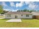 Spacious backyard featuring a concrete patio and lush green lawn at 1626 Cobbs Creek Ln, Decatur, GA 30032
