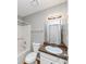 Bathroom features a shower, toilet, vanity with sink, and mirror with lighting at 1626 Cobbs Creek Ln, Decatur, GA 30032