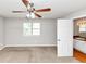 Bedroom featuring a window, ceiling fan, and an attached bathroom, offering a private retreat at 1626 Cobbs Creek Ln, Decatur, GA 30032