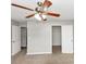 This is a standard bedroom view featuring ceiling fan, two doors, and neutral carpet at 1626 Cobbs Creek Ln, Decatur, GA 30032
