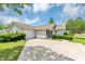 Charming single-story home with attached garage, well-maintained lawn, and inviting curb appeal at 1626 Cobbs Creek Ln, Decatur, GA 30032