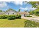 Charming single-story home featuring a well-manicured lawn and beautiful landscaping at 1626 Cobbs Creek Ln, Decatur, GA 30032