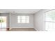 Bright room with sliding glass door, carpet and hardwood floors at 1626 Cobbs Creek Ln, Decatur, GA 30032