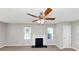 Open living room showcasing a fireplace, windows, and neutral paint at 1626 Cobbs Creek Ln, Decatur, GA 30032