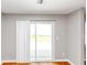 A view of the living room with sliding glass doors and natural light at 1626 Cobbs Creek Ln, Decatur, GA 30032