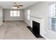 Spacious living room featuring a fireplace, neutral paint and carpet floors at 1626 Cobbs Creek Ln, Decatur, GA 30032