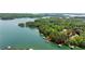 Aerial shot showing the lakefront property with private docks on a serene lake at 4290 Bobbins Way, Cumming, GA 30041