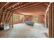 Spacious attic with exposed beams and natural light; ready for finishing as a bonus room or extra living space at 4290 Bobbins Way, Cumming, GA 30041