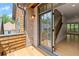 Balcony with wooden planks, overlooking brick and interior staircase at 4290 Bobbins Way, Cumming, GA 30041