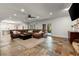 Basement has beautiful slate floors, recessed lighting, and a Gathering seating area with a large, comfortable couch at 4290 Bobbins Way, Cumming, GA 30041