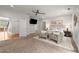 Light-filled bedroom boasts stylish furnishings, a ceiling fan, and a large doorway at 4290 Bobbins Way, Cumming, GA 30041