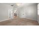 Bedroom with neutral carpeting, ceiling fan and open doorways at 4290 Bobbins Way, Cumming, GA 30041