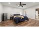 Bedroom with hardwood floors, ceiling fan and a mini fridge in close proximity to the bathroom at 4290 Bobbins Way, Cumming, GA 30041