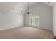 Spacious bedroom features a vaulted ceiling, a ceiling fan, and bright natural light at 4290 Bobbins Way, Cumming, GA 30041