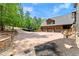 Long driveway leading to a three-car garage with landscaping at 4290 Bobbins Way, Cumming, GA 30041