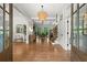 Elegant foyer featuring hardwood floors, a coffered ceiling, and an open view to the dining area at 4290 Bobbins Way, Cumming, GA 30041