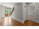 Upstairs hallway with hardwood flooring, and natural light at 4290 Bobbins Way, Cumming, GA 30041