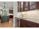 Gourmet kitchen with granite countertops, stainless steel appliances, a wine cooler, and elegant cabinetry at 4290 Bobbins Way, Cumming, GA 30041