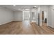 Living room with hardwood floors and multiple points of egress offer an abundance of natural light and access to the home at 4290 Bobbins Way, Cumming, GA 30041