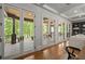 Living room with french doors that provide access to the covered outdoor porch at 4290 Bobbins Way, Cumming, GA 30041