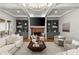 Coffered ceilings and built-in shelving adds architectural interest to this inviting living room and fireplace at 4290 Bobbins Way, Cumming, GA 30041