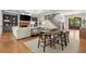 Open floor plan offers living room with fireplace and built-ins adjacent to dining area and grand staircase at 4290 Bobbins Way, Cumming, GA 30041