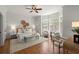 Bright main bedroom features a bay window, decor, and hardwood floors at 4290 Bobbins Way, Cumming, GA 30041