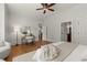 Bright main bedroom with a bay window, hardwood floors and a desk at 4290 Bobbins Way, Cumming, GA 30041