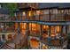 Multi-level decks create an inviting outdoor living space with seating, dining, and fire pit at 4290 Bobbins Way, Cumming, GA 30041