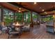 Covered porch with an outdoor kitchen and seating offers privacy and nature views at 4290 Bobbins Way, Cumming, GA 30041