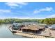 Aerial view of the waterfront restaurant and tiki bar on the lake, with boat docks and piers at 4290 Bobbins Way, Cumming, GA 30041