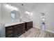 Elegant bathroom with dual vanities, marble countertops, and modern fixtures at 7580 Blacks Mill Rd, Cumming, GA 30028