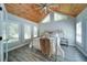 Charming bedroom with wood ceiling, modern ceiling fan and ample natural light at 7580 Blacks Mill Rd, Cumming, GA 30028