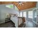 Comfortable bedroom with vaulted ceiling, modern ceiling fan and plenty of natural light at 7580 Blacks Mill Rd, Cumming, GA 30028