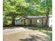 Charming single-story home with a spacious front yard and inviting curb appeal, ideal for Gathering living at 7580 Blacks Mill Rd, Cumming, GA 30028