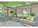Inviting front porch featuring stylish outdoor seating, decorative plants, and a warm, welcoming entrance at 7580 Blacks Mill Rd, Cumming, GA 30028