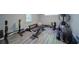 Well-equipped home gym with various exercise machines and free weights at 7580 Blacks Mill Rd, Cumming, GA 30028