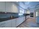 Bright and spacious kitchen with granite countertops, stainless steel appliances, and ample cabinet storage at 7580 Blacks Mill Rd, Cumming, GA 30028