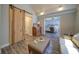Relaxing living room with modern sliding barn door and comfortable furniture at 7580 Blacks Mill Rd, Cumming, GA 30028