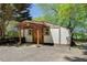 Multi-purpose shed with wooden doors and ample space for storage and projects at 7580 Blacks Mill Rd, Cumming, GA 30028