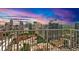 Stunning balcony view overlooking the city skyline at dusk, with modern railing and cityscape backdrop at 860 Peachtree Ne St # 2815, Atlanta, GA 30308